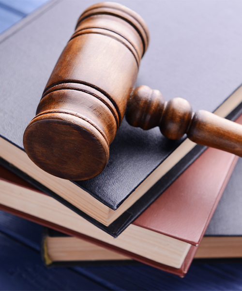 A gavel and legal books